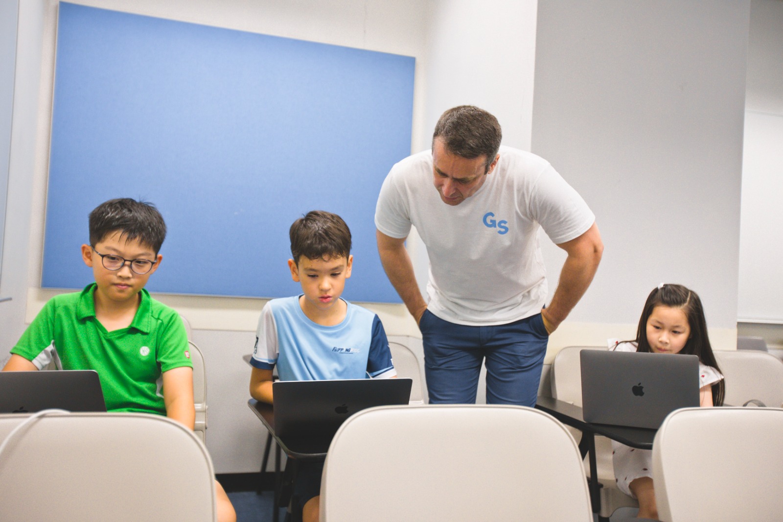 Students collaborating on AI projects
